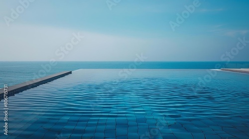 infinity pool merging with ocean horizon under a blue sky