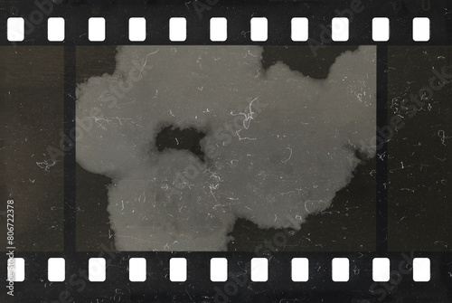 Damaged celluloid filmstrip. Splots, dust and scratches