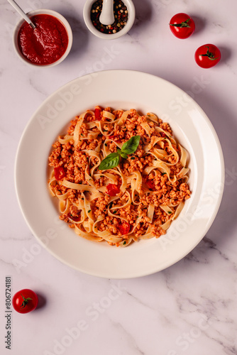 Vegan Bolognese Pasta with plant based minced meat. © tbralnina