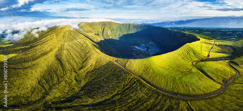 Panorama of drone green sunrise landscape of volcano Gordo caldera in Faial island - Azores, Portugal photo