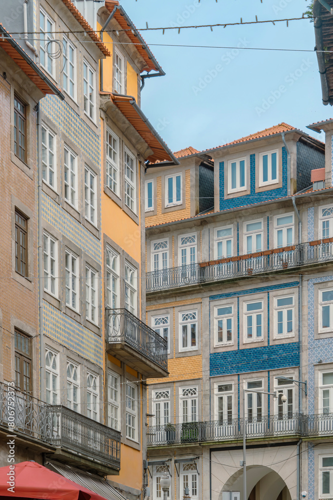 Traditional Porto Portugal properties with balconies and famous tiles covering the facade. Porto. Portugal.