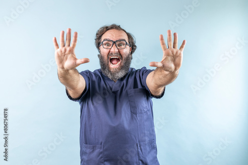 Surgeon doctor man making stop and shouting gesture