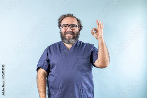 Surgeon doctor smiling man showing  ok sign