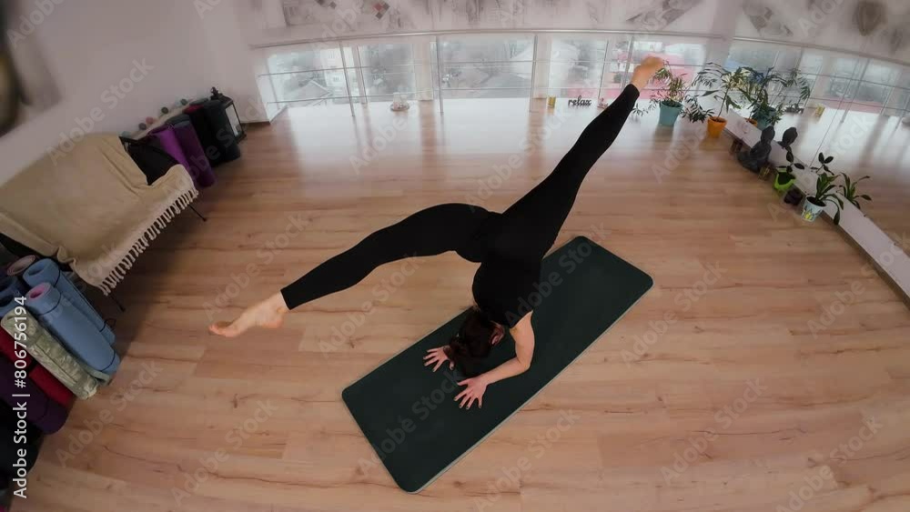 Young woman doing meditation exercise for flexibility and stretching sports yoga, clothes black sportswear. Female practicing yoga concept natural balance between body and mental development