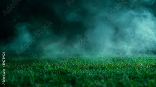 This powerful image shows a dense fog cascading over a lush grass field at what seems to be dusk, creating a captivating scene