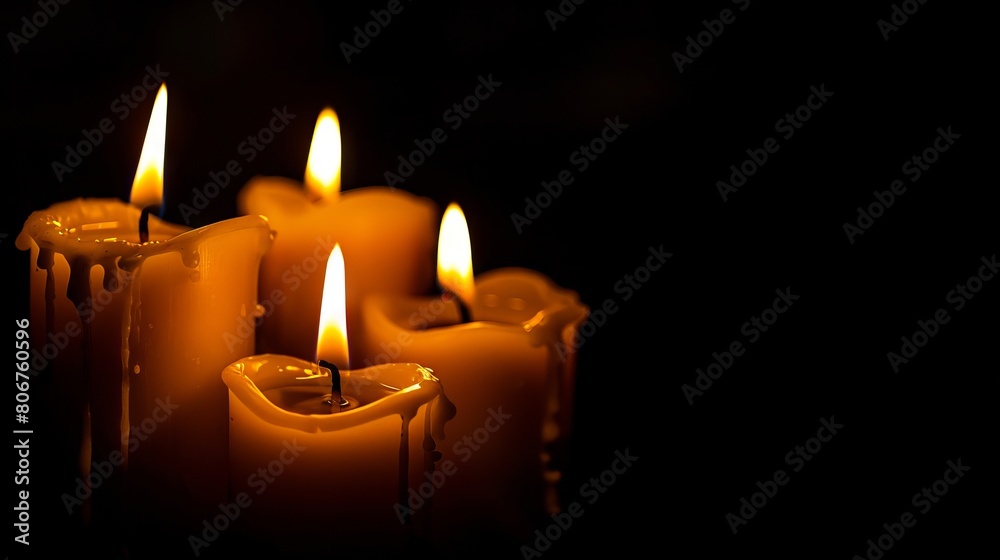 Three candles are lit in the dark. Three candles are lit in the dark.