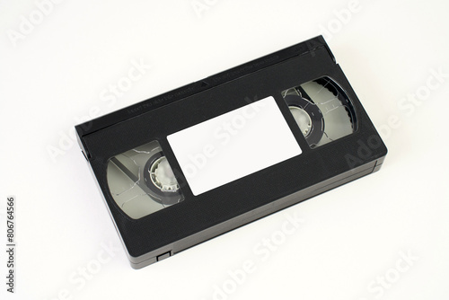 Video cassette tape on white background, close-up