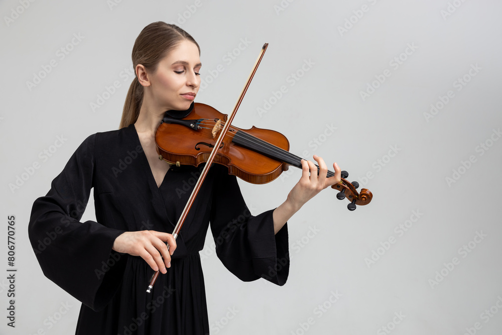 Woman professional violist playing musical instrument Woman professional violist playing musical instrument