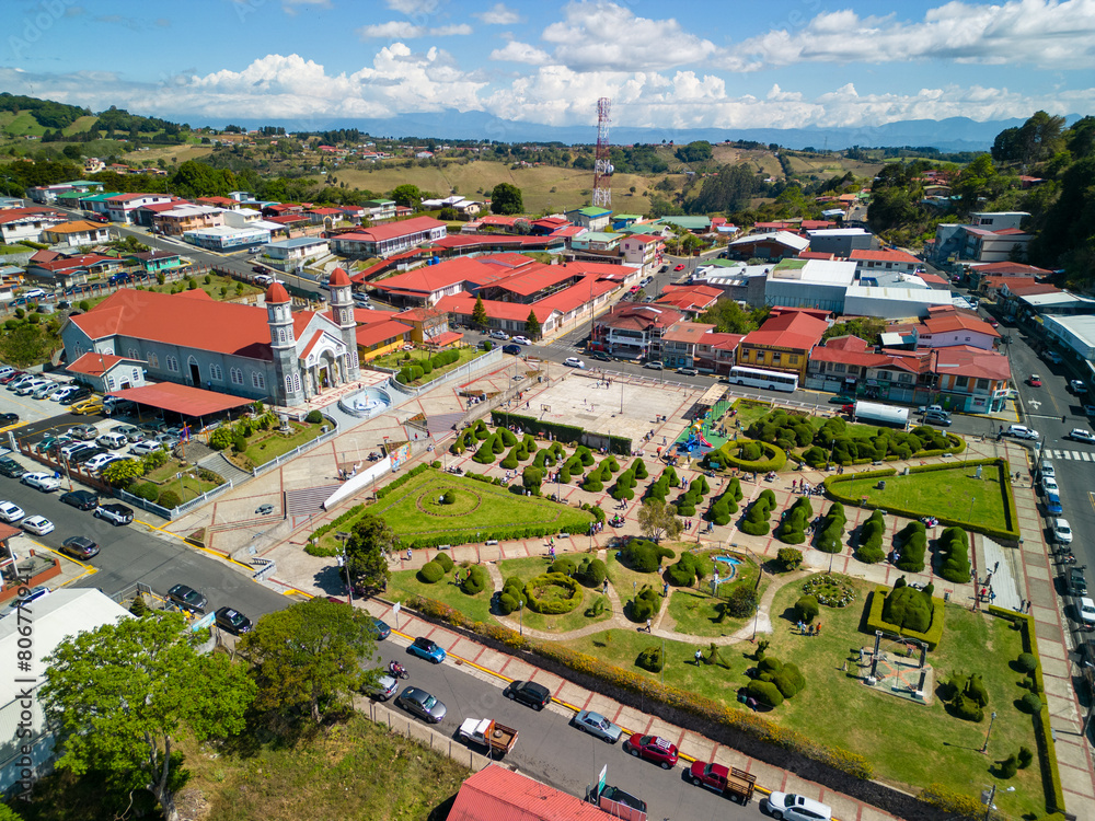 Naklejka premium Aerial view of Zarcero Park in Alajuela, Costa Rica, on a sunny day