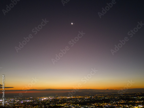 Canvas Print Scenic view of sunset with Moon, Jupiter, and Venus in conjunction