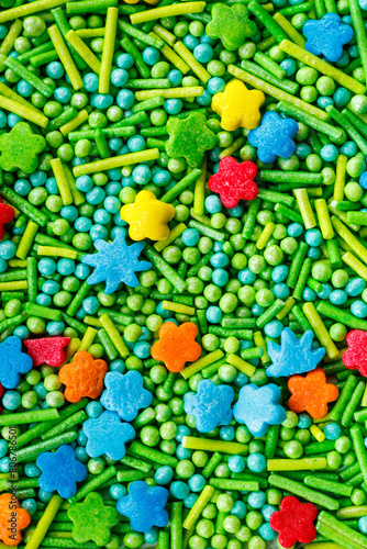 The texture of candy sprinkles.Varied sugar sprinkles, stars, flowers, dots.Holiday treat.Toppings for donuts,cupcake, desserts and ice cream .