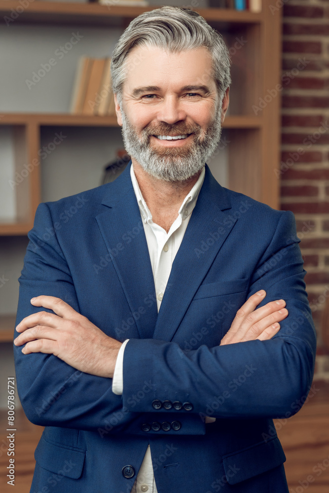 Friendly middle aged man psychotherapist wearing formal wear posing and smiling Friendly middle aged man psychotherapist wearing formal wear posing and smiling