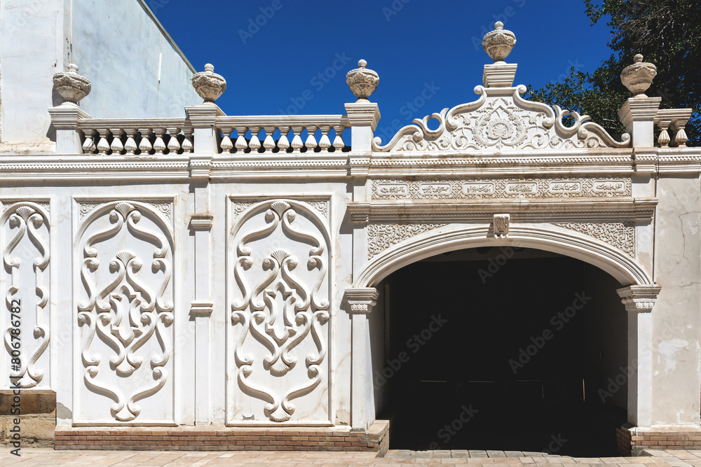 Naklejka premium Elegant ornamental gate of Emir's Summer Palace in Bukhara, showcasing traditional designs. Bukhara, Uzbekistan