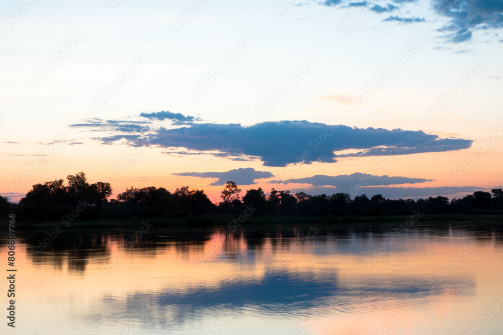 Beautiful panorama sunrise view at the area of the Okavango River near Divundu and Mahango national park. Namibia, Africa. Tourism and vacatins concept. Beautiful panorama sunrise view at the area of the Okavango River near Divundu and Mahango national park. Namibia, Africa. Tourism and vacatins concept.