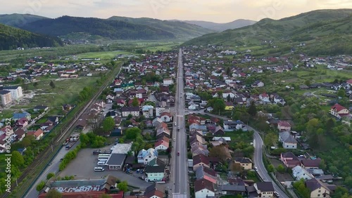 Stefan cel Mare street from Gura Humorului city at sunet filmed from drone photo