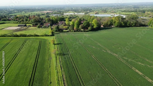 Arable farmland and view over the Weald of Kent,  near the village of Chart Sutton, Maidstone, Kent, UK. May / spring [Drone]