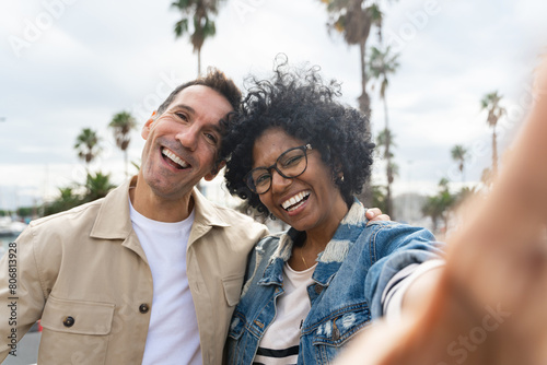 Self selfie portrait of African American woman and caucasian man couple  photo