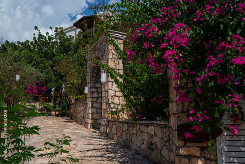 Old village. Charming old streets. Typical beautiful village with flowers in facades in Spain.