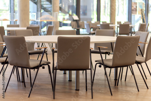 
chairs and round tables in the restaurant photo