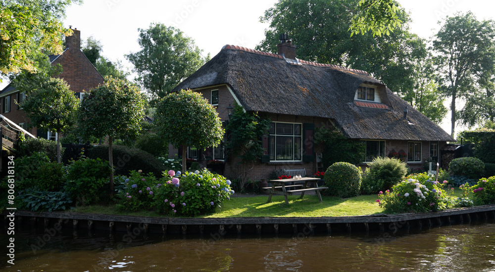 Typical houses of Giethoorn, Netherlands with gardens. Town is know as 