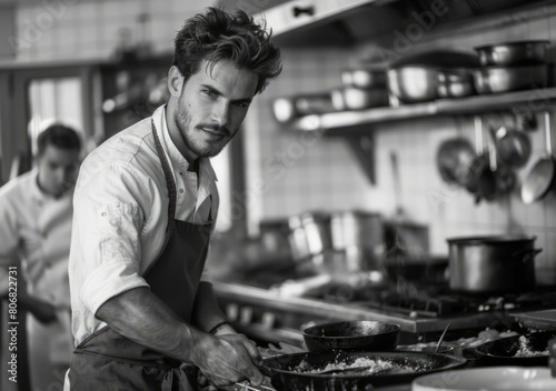 Black and white portrait of a male chef in a kitchen
