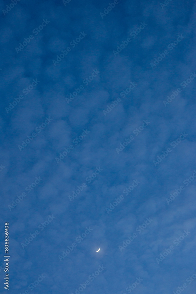 beautiful sky landscape Blue thin clouds and a moon There is space for text. Crescent moon.