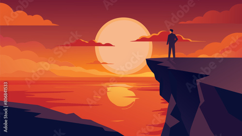 A person standing on the edge of a cliff overlooking the ocean as the sun dips below the horizon and the sky turns a fiery orange..