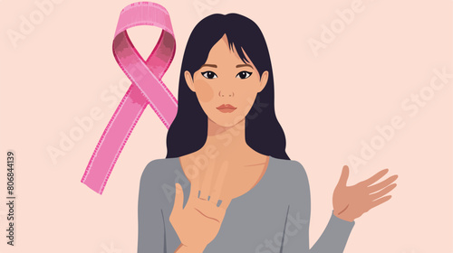 Young Asian woman with pink ribbon showing STOP gesture
