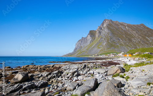 Coastline at Vikten, Lofoten Islands, Norway. Beautiful summer day. Famous tourist travel destination. photo