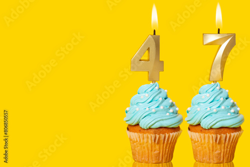 Birthday Cupcakes With Candles Lit Forming The Number 47