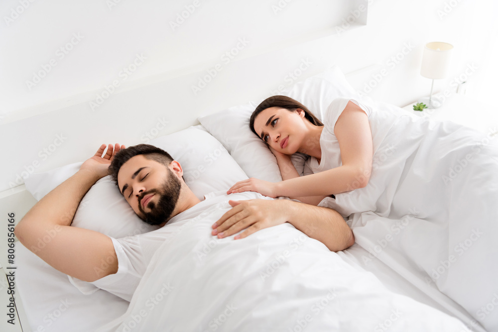 Photo of two couple sleeping girl have insomnia touch guy in bed room Photo of two couple sleeping girl have insomnia touch guy in bed room
