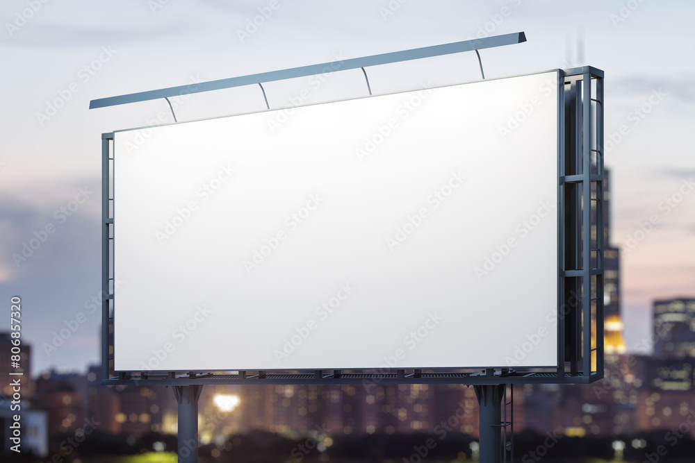Blank white billboard on cityscape background at evening, perspective view. Mock up, advertising concept Blank white billboard on cityscape background at evening, perspective view. Mock up, advertising concept