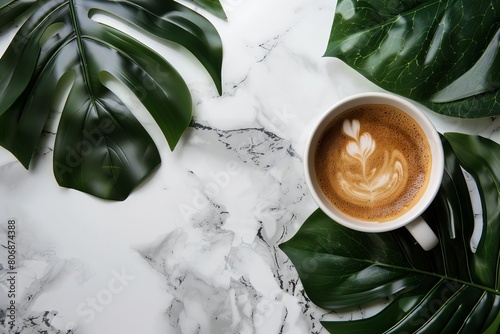aesthetic top view of hot coffee cup on marble with tropical leaves serene and stylish flat lay