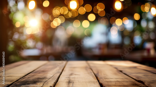 Wooden table with blurred restaurant background and light bokeh