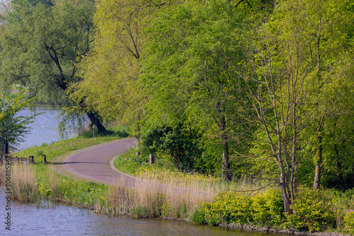 Wallpaper Mural Spring landscape view along the Amstel river, The river flows from the Aarkanaal and Drecht in Nieuwveen northwards passing Uithoorn, Amstelveen and Ouderkerk aan de Amstel, North Holland, Netherlands Torontodigital.ca