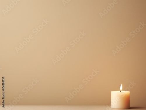 Beige background with white thin wax candle with a small lit flame for funeral grief death dead sad emotion with copy space texture for display 