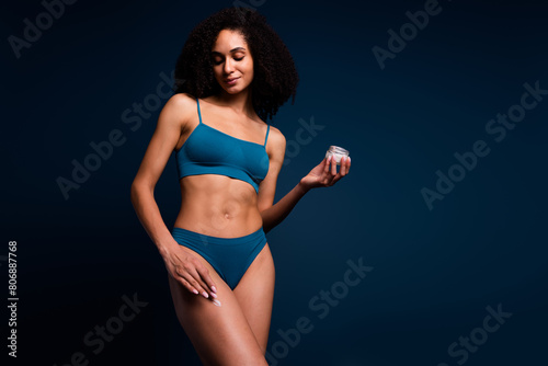 No filter photo of sweet lady underwear lingerie apply cream loving body positive empty space isolated blue color background