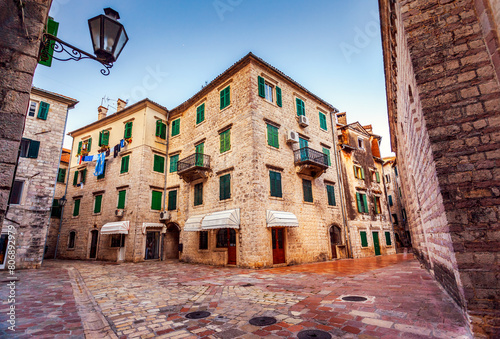 Attractive view of the cozy street in Kotor old town. Montenegro, Balkan peninsula, Europe.