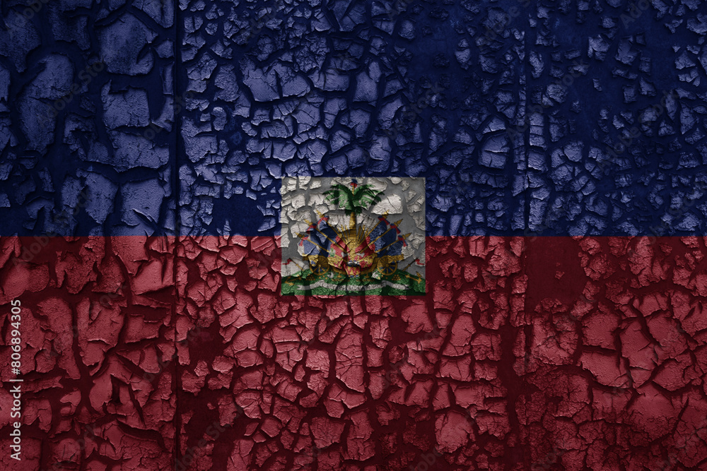 Fototapeta premium flag of haiti on a old grunge metal rusty cracked wall background