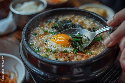 Comforting Korean Juk Porridge Nourishment in a Bowl on a Chilly Evening photo