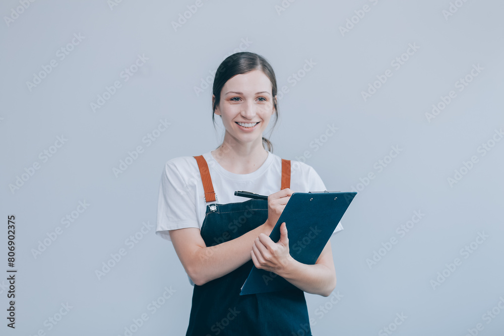 .Cheerful beautiful Asian woman wearing jeans overalls with excited doing winner gesture with arms raised isolated on white background. .Cheerful beautiful Asian woman wearing jeans overalls with excited doing winner gesture with arms raised isolated on white background.