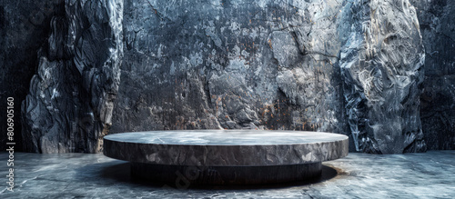 Empty cylinder pedestal podium on grey stone cave background. Minimal scene for product display presentation. © Margaryta