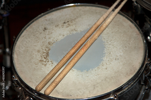 Old bass drum and drumsticks