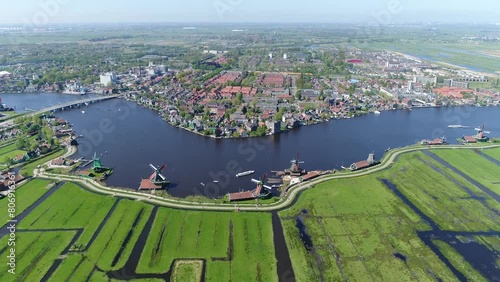 High altitude aerial view of Zaanse Schans is a neighbourhood of Zaandam near Amsterdam in the Netherlands it is best known for its collection of well-preserved historic windmills and homes 4k photo