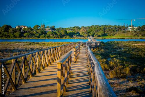 Quinta do Lago Bridge in Ria Formosa natural park in Faro, Algarve in Portugal during sunset photo