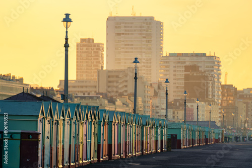 Selective focus view of huts on the Brighton beach at sunrise. England 