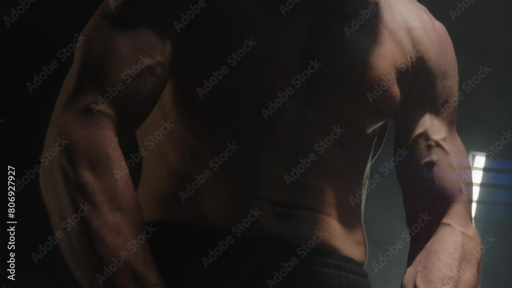 close-up of muscular sweaty torso of man flexing muscles close-up of muscular sweaty torso of man flexing muscles