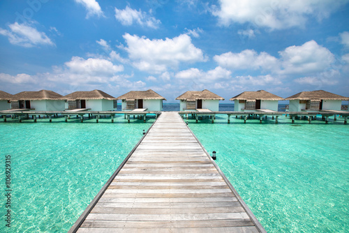 Maldives paradise island with luxurious water villas hotel resort, beach vacation
