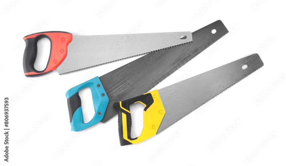 Saws with colorful handles isolated on white, top view Saws with colorful handles isolated on white, top view