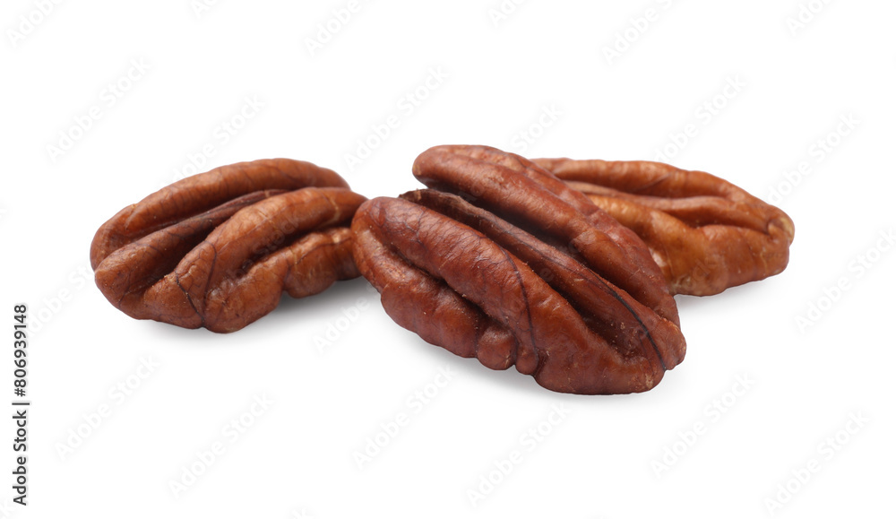 Three tasty pecan nuts isolated on white Three tasty pecan nuts isolated on white